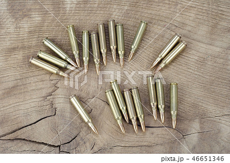 Ammunition on wooden background 46651346