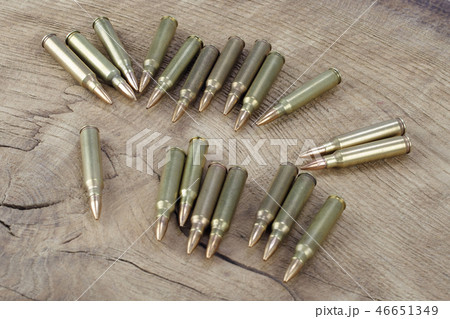 Ammunition on wooden background 46651349