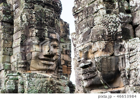smiling stone face on tower at Bayon castle smiling stone face on tower at Bayon castle 46653984