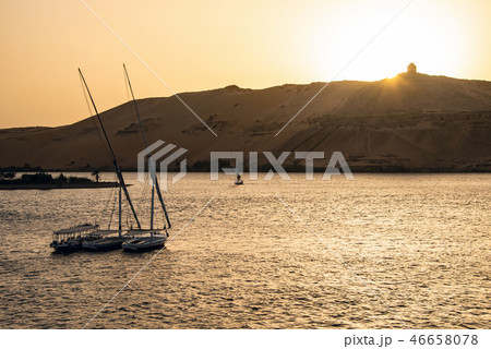 sunset Nile Aswan and the West Bank with Tombs Old Kingdom Qubbet el-Hawa - 'Dome of the Winds' at 46658078