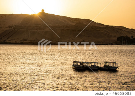 sunset Nile Aswan and the West Bank with Tombs Old Kingdom Qubbet el-Hawa - 'Dome of the Winds' at 46658082