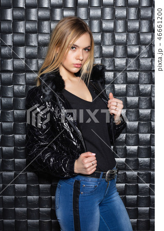 Attractive blonde posing on a white sofa Attractive blonde posing on a white sofa 46661200