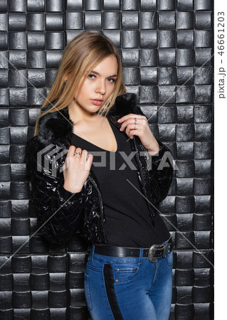 Attractive blonde posing on a white sofa Attractive blonde posing on a white sofa 46661203