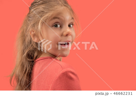 Cute little girl in coral dress with long hair smiling to camera Cute little girl in coral dress with long hair smiling to camera 46662231