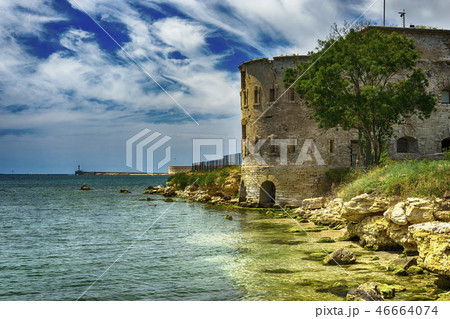 Old damaged by war fort in the Black Sea coast. Coastal Michael's fortress in Sevastopol, Crimea Old damaged by war fort in the Black Sea coast. Coastal Michael's fortress in Sevastopol, Crimea 46664074