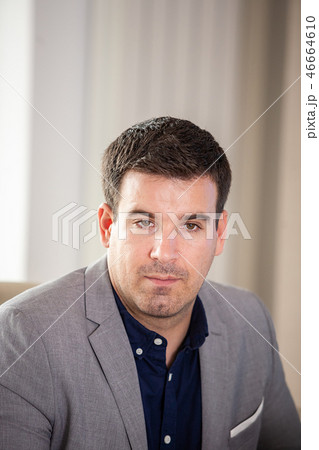 Portrait of businessman in conference room looking away 46664610