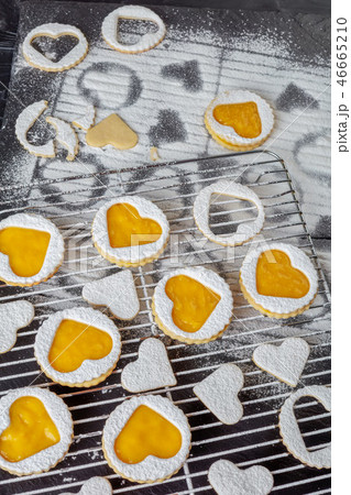 Heart shaped linzer cookies on a wire rack Heart shaped linzer cookies on a wire rack 46665210