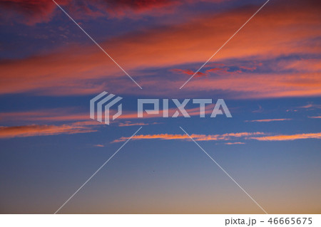 dramatic blue sky with orange clouds at sunset 46665675