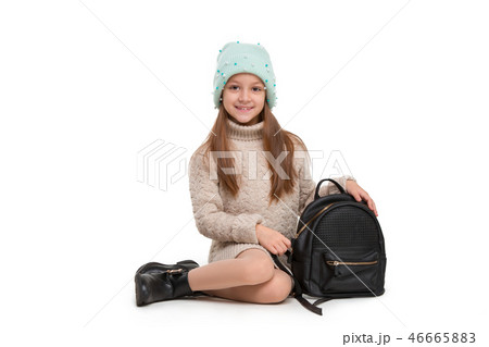 portrait of cute little kid in stylish jeans clothes looking at camera and smiling portrait of cute little kid in stylish jeans clothes looking at camera and smiling 46665883