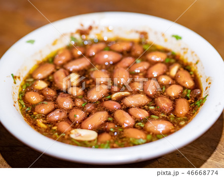 Peanuts with spices and chili sauce Peanuts with spices and chili sauce 46668774