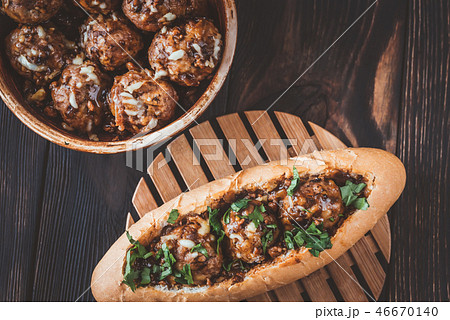 Hot dog bun stuffed with meatballs Hot dog bun stuffed with meatballs 46670140