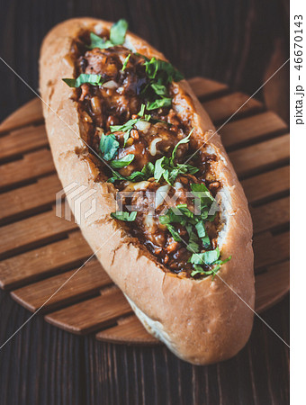 Hot dog bun stuffed with meatballs 46670143