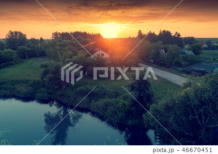 View of countryside and lake in evening 46670451