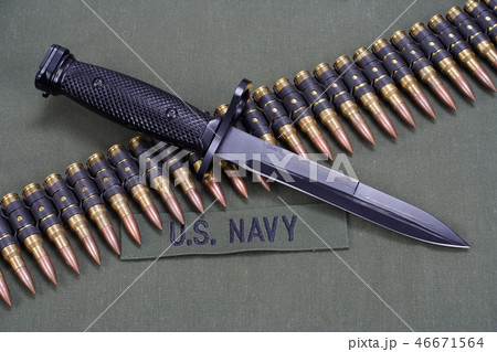 ammunition belt on US NAVY uniform background ammunition belt on US NAVY uniform background 46671564