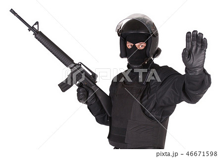 Riot police officer with weapon in black uniform Riot police officer with weapon in black uniform 46671598