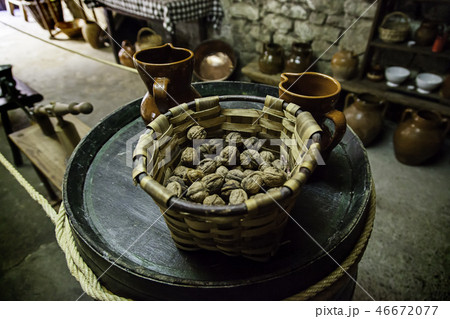 Dried walnuts in a Christmas basket Dried walnuts in a Christmas basket 46672077