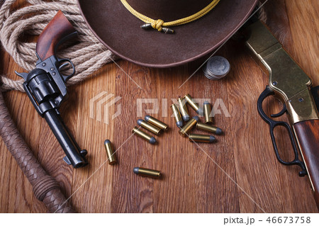 Wild west rifle, ammunition and sheriff badge Wild west rifle, ammunition and sheriff badge 46673758