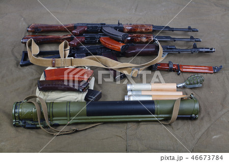 Kalashnikov AK 47 on canvas background Kalashnikov AK 47 on canvas background 46673784