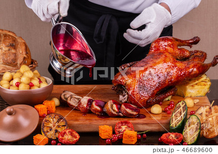 A duck with grilled vegetables and new potato in b 46689600