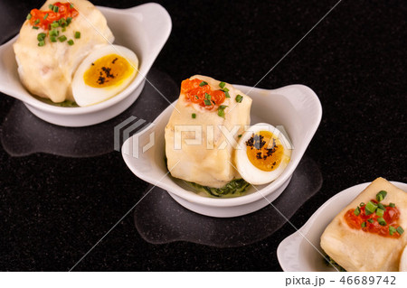 A Siberian salmon in sauce with quail egg, red cav 46689742