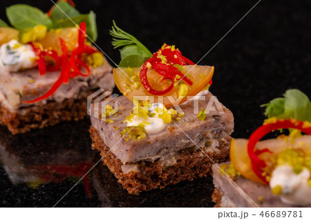 Small black bread and souffle sandwich from a fish Small black bread and souffle sandwich from a fish 46689781