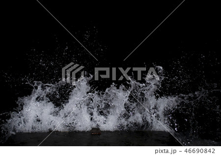 Splashing wave on the Black sea in the night. 46690842