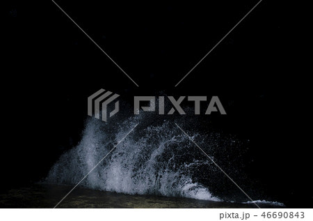 Splashing wave on the Black sea in the night. 46690843