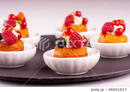 Desserts with berries and vanilla cream 46691657