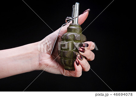 fragmentation grenade in girl hand fragmentation grenade in girl hand 46694078