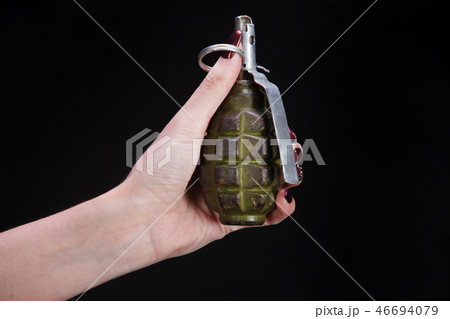 fragmentation grenade in girl hand 46694079
