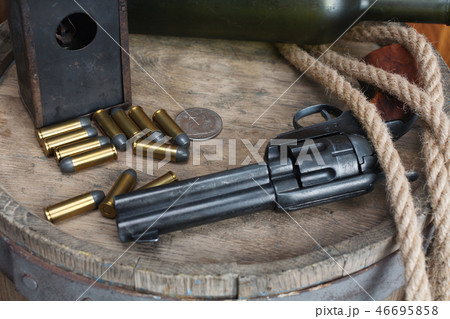 Old western revolver with cartridges 46695858