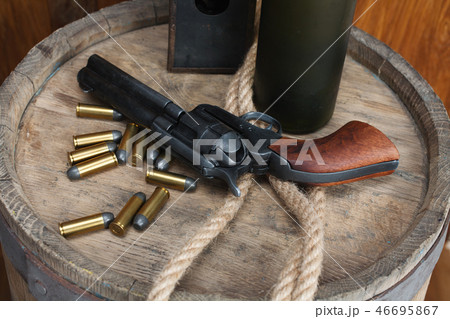 Old western revolver with cartridges Old western revolver with cartridges 46695867