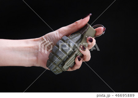 fragmentation grenade in woman hand fragmentation grenade in woman hand 46695889