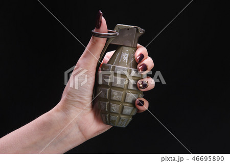fragmentation grenade in woman hand fragmentation grenade in woman hand 46695890