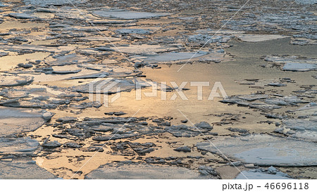 broken ice on a winter river with sunset sky reflection broken ice on a winter river with sunset sky reflection 46696118