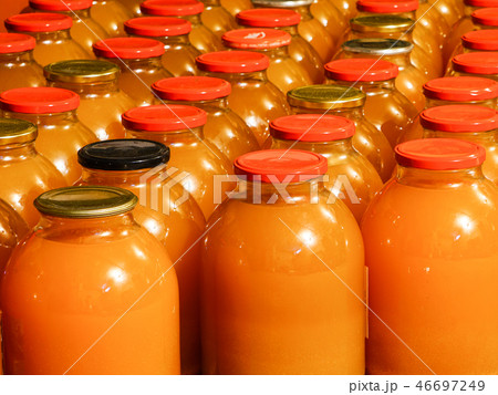 homemade apple juice in three liter glass jars 46697249