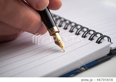 hand of woman writing with vintage pen hand of woman writing with vintage pen 46705656