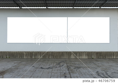 Large blank billboard on a street wall 46706759