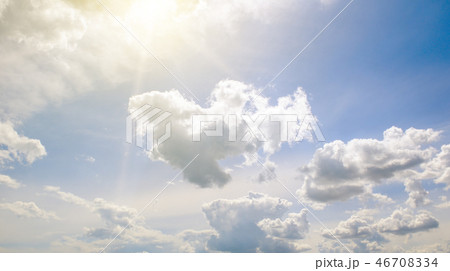 Sun on blue sky with white clouds. 46708334