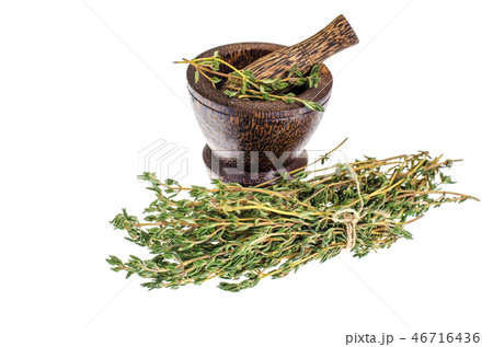 Thyme sprigs, mortar, pestle, herb for cooking 46716436