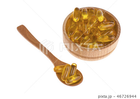 Yellow vitamin soft gelatin capsules oily drug 46726944