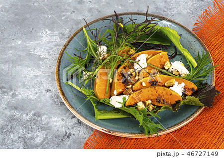 Salads with pumpkin, goat cheese and walnuts 46727149