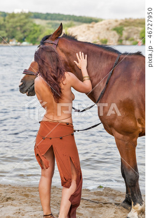 horse and beautiful naked woman on river beach horse and beautiful naked woman on river beach 46727950