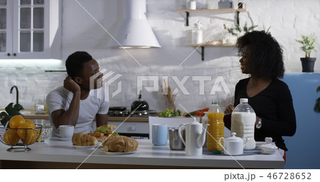 Man and woman talking during breakfast 46728652