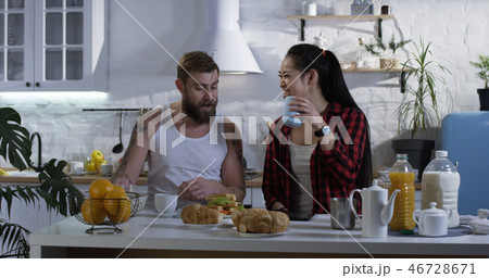 Couple talking during breakfast Couple talking during breakfast 46728671
