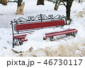 A forged metal bench and wood in the park are thrown in snow during the thaw 46730117