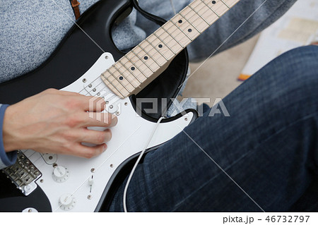 Male hands at home play and tun Male hands at home play and tun 46732797