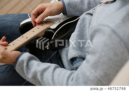 Male hands at home play and tun Male hands at home play and tun 46732798