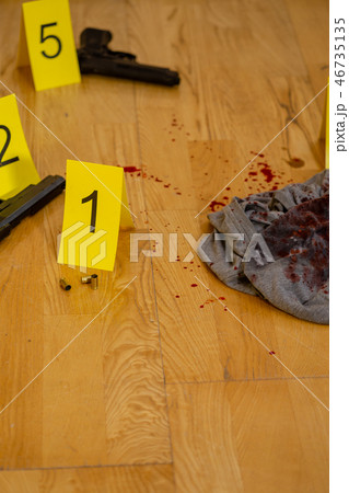 Bullets, bloody clothes and gun at crime scene Bullets, bloody clothes and gun at crime scene 46735135