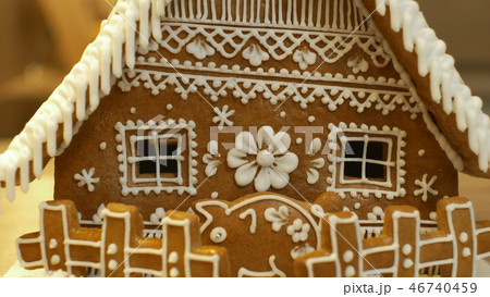 Gingerbread house and cottage cake beautiful, a fence with a piggy bank, decorated with a Gingerbread house and cottage cake beautiful, a fence with a piggy bank, decorated with a 46740459